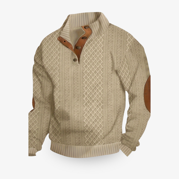 Pull beige en maille torsadée avec coudières en cuir