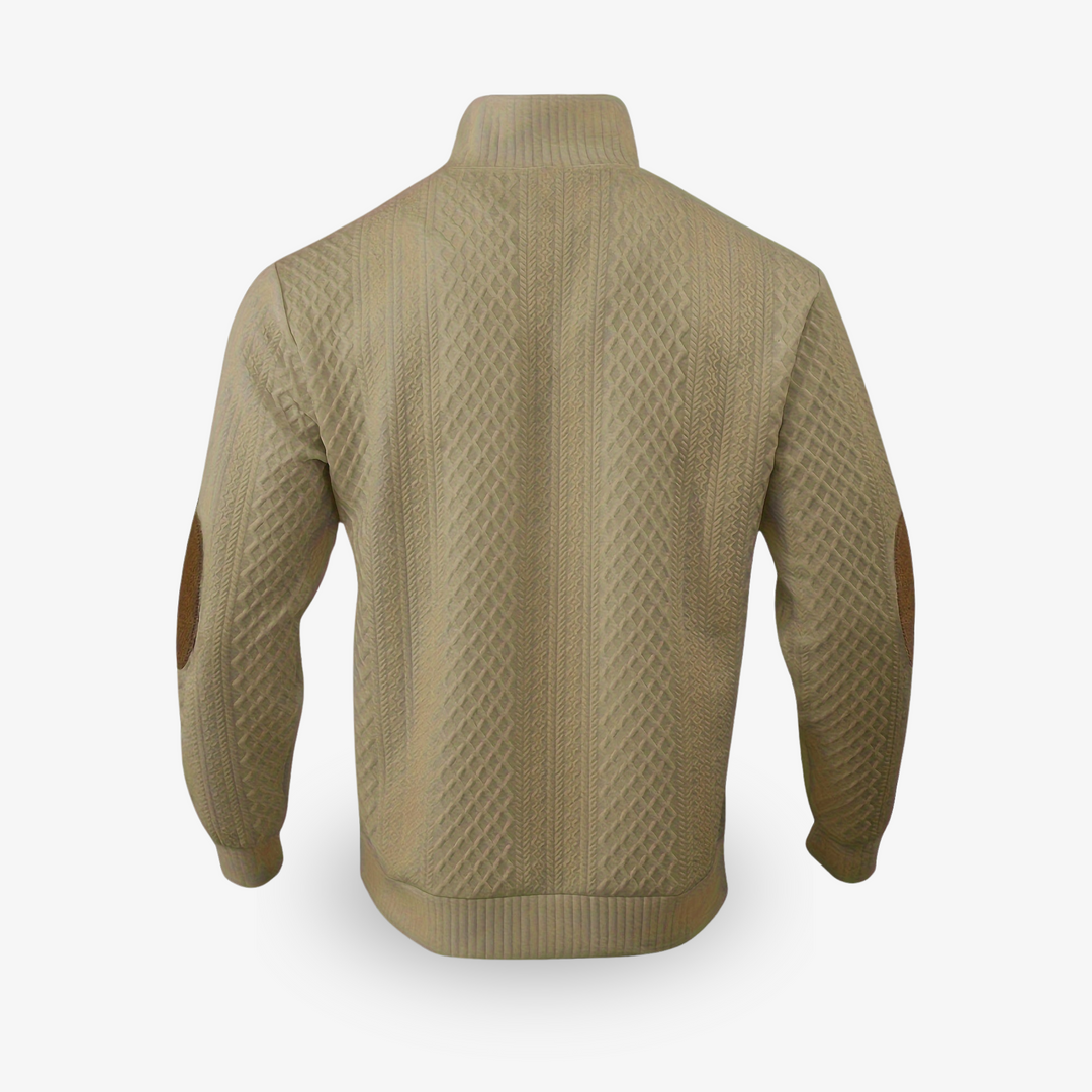 Pull beige en maille torsadée avec coudières en cuir