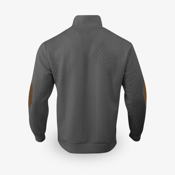 Pull beige en maille torsadée avec coudières en cuir